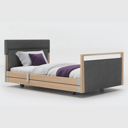 Opera Signature Upholstered Profiling Bed With Cot Sides & Memory Mattress. The padded head and footboard design ensure's a comfortable and elegant finish. With height adjustment and full profiling features, this care bed is suitable for almost all user types.