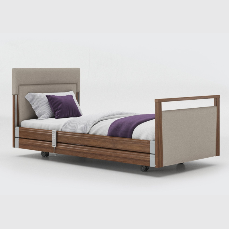 Opera Signature Upholstered Profiling Bed With Cot Sides & Memory Mattress. The padded head and footboard design ensure's a comfortable and elegant finish. With height adjustment and full profiling features, this care bed is suitable for almost all user types.