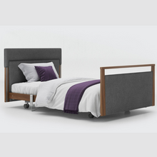 Load image into Gallery viewer, Opera Signature Upholstered Profiling Bed. The padded head and footboard design ensure&#39;s a comfortable and elegant finish. With height adjustment and full profiling features, this care bed is suitable for almost all user types.