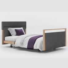 Load image into Gallery viewer, Opera Signature Upholstered Profiling Bed. The padded head and footboard design ensure&#39;s a comfortable and elegant finish. With height adjustment and full profiling features, this care bed is suitable for almost all user types.