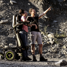 Load image into Gallery viewer, The Q700-UP M Ergo is a top-of-the-line power wheelchair that offers excellent maneuverability in tight compact spaces.